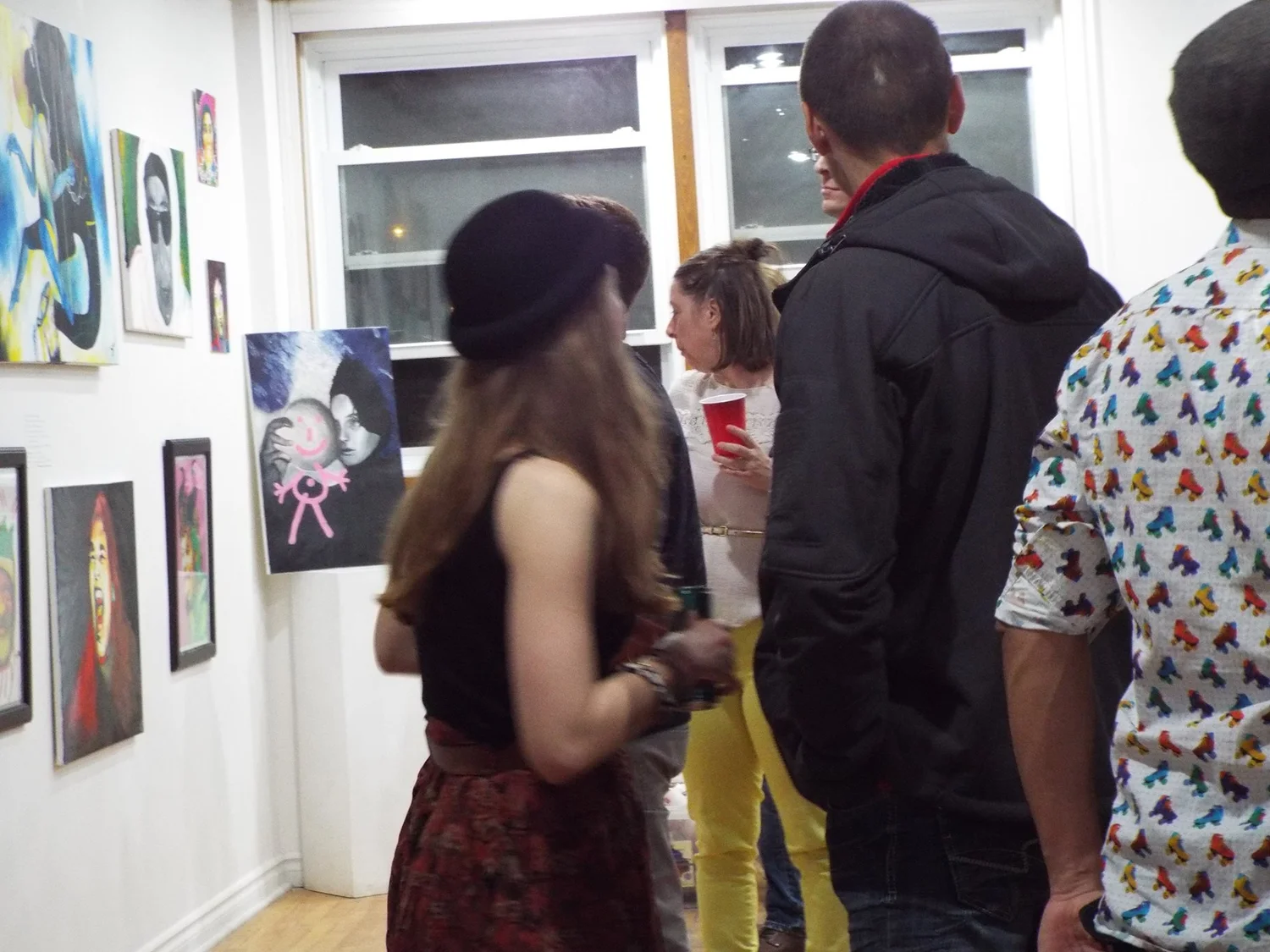 crowd mingling at the opening