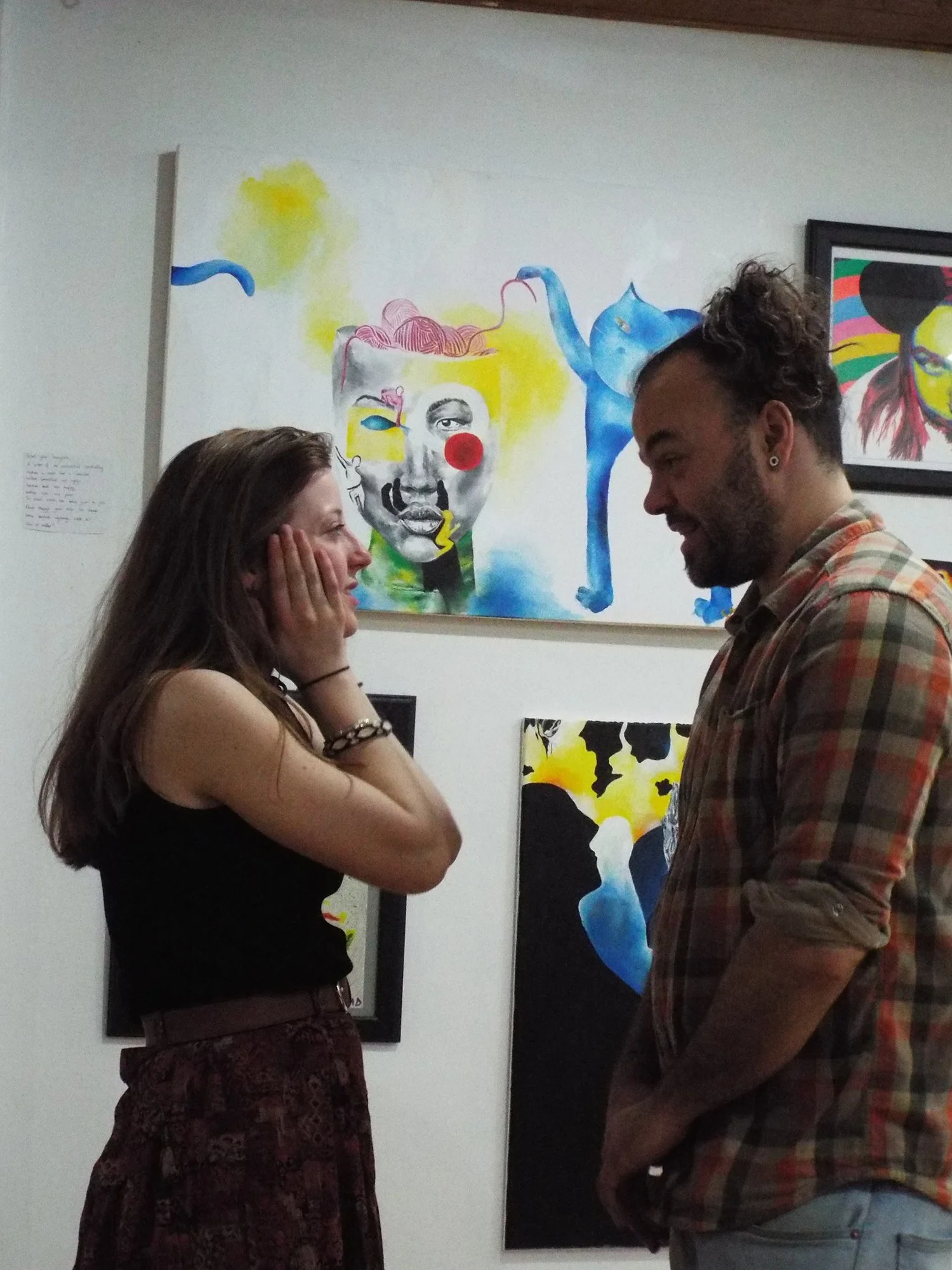 conversation in front of artwork