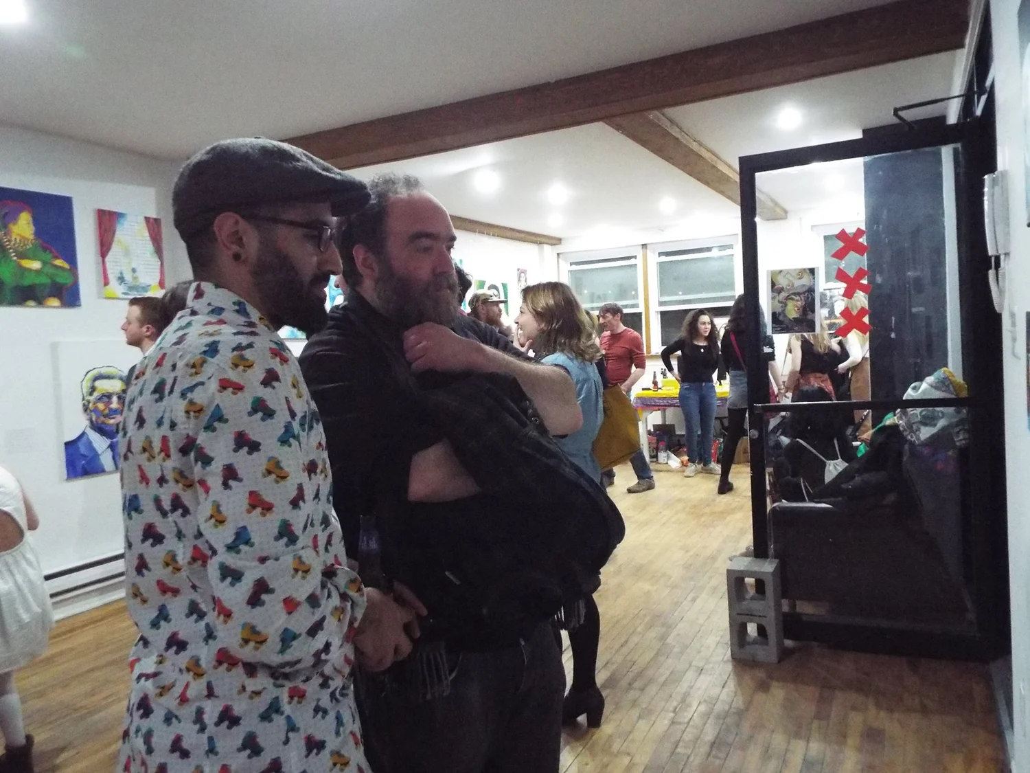 friends embracing at the gallery