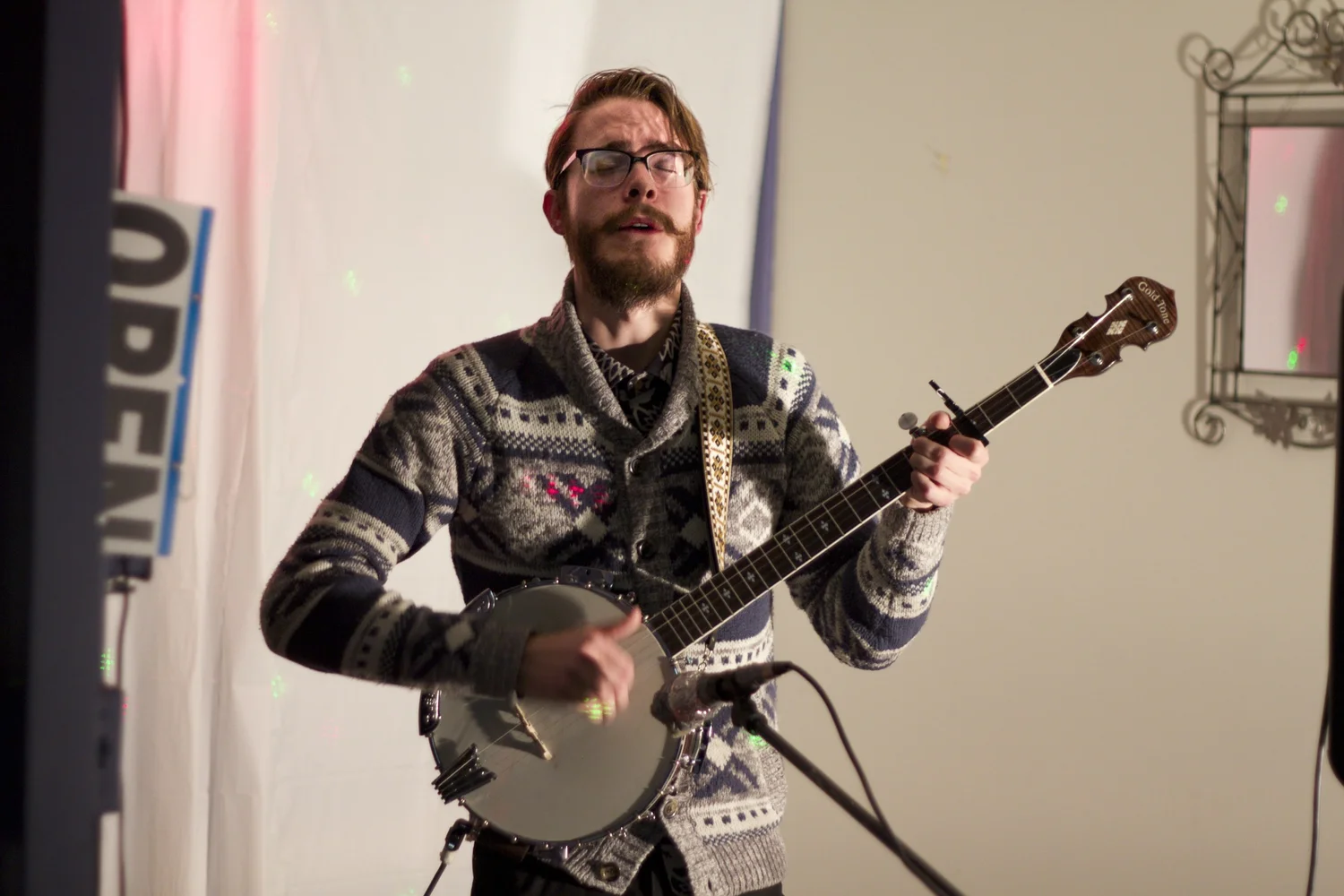 Jesse performing banjo with laser lights
