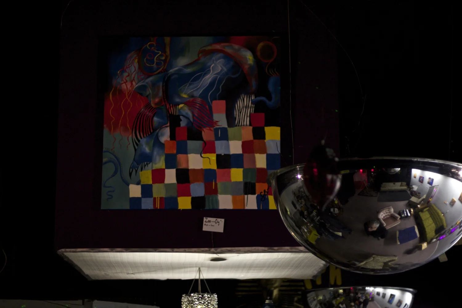 painting hung above the gallery with a convex mirror reflecting the room